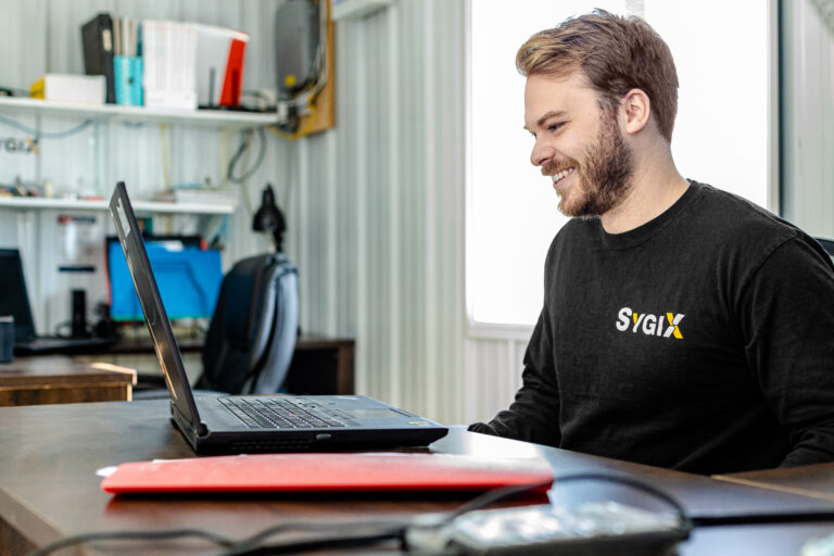 Photo of William, co-owner of SYGIX, smiling in the office
